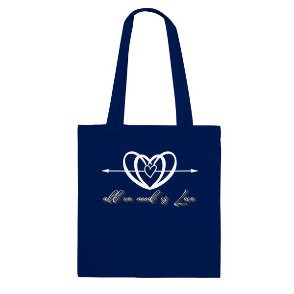 511cdd0b-3cb9-44e7-9a95-b411c57036fb.jpg Navy tote bag with the All We Need is Love heart and script design