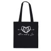 713de905-7f55-4d5d-b92a-f75d45eae9e0.jpg Black tote bag with the All We Need is Love heart and script design