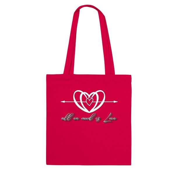 76cd4549-643b-4612-bd47-107850a4f6fd.jpg Red tote bag with the All We Need is Love heart and script design