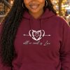 All We Need is Love hoodie – Nia (AI model) AI-generated model Nia wearing the maroon All We Need is Love hoodie on an autumn street
