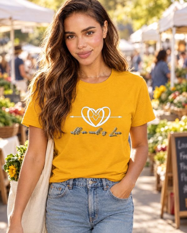 AI-generated model Maya wearing the golden-yellow All We Need is Love crewneck T-shirt at a farmers market