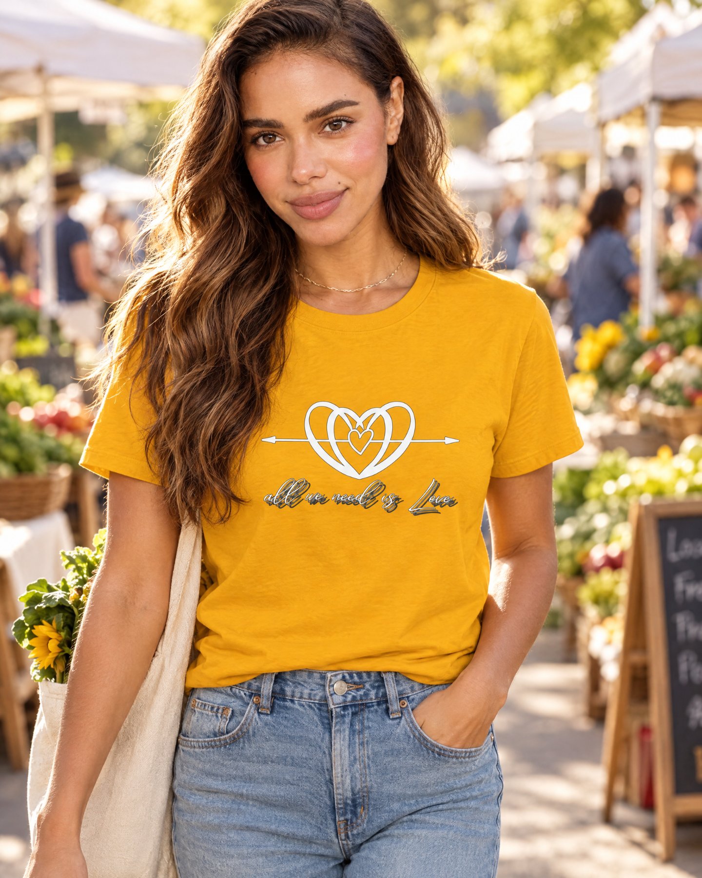 AI-generated model Maya wearing the golden-yellow All We Need is Love crewneck T-shirt at a farmers market