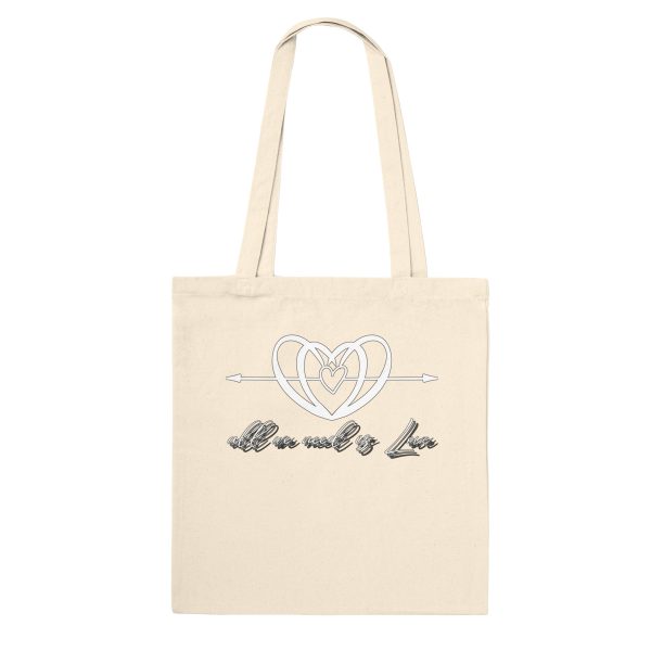 de406a49-0f36-467a-9e00-249eed91f360.jpg Natural tote bag with the All We Need is Love heart and script design